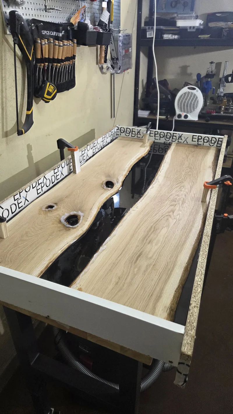 The oak slabs placed in a white casting mould in the workshop